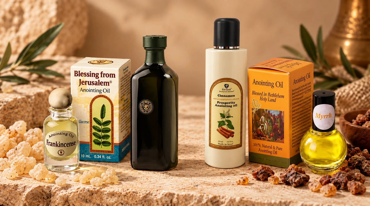 Frankincense and Myrrh anointing oil bottles displayed side by side with their original packaging on a natural beige background.