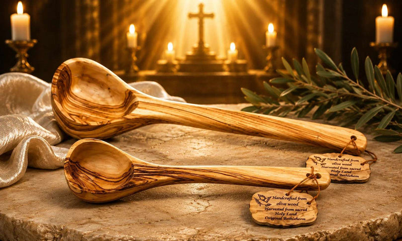 Handcrafted olive wood ladles from Bethlehem displayed on a rustic stone surface with engraved wooden tags and warm church background.