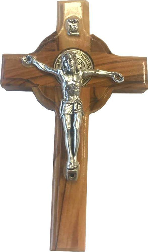 Front of olive wood Celtic crucifix, silver corpus over gold St. Benedict medal