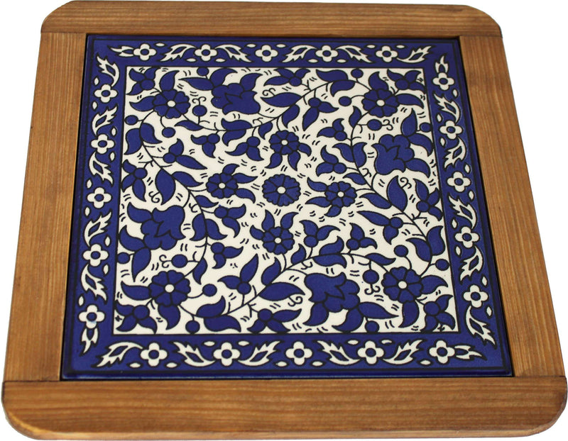 Cobalt blue square floral pattern on white tile in pine wood frame