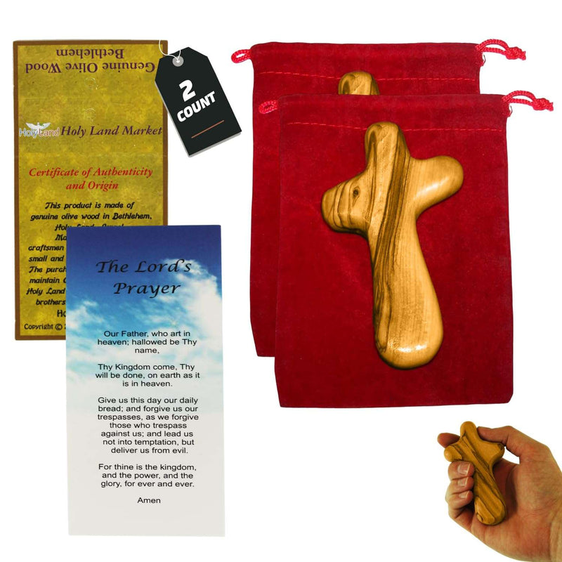 Two olive wood comfort holding crosses with two red velvet bags
