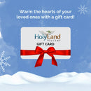 HolyLandMarket gift card with a red ribbon on a snowy winter background