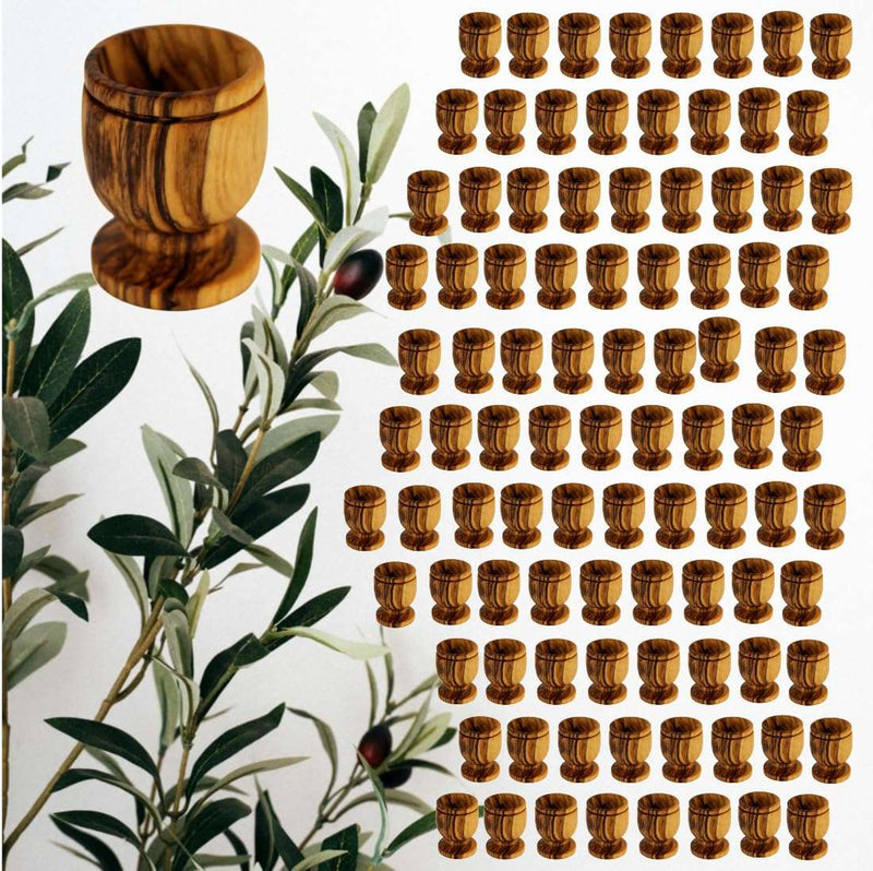 One hundred olive wood communion cups filling the frame in rows