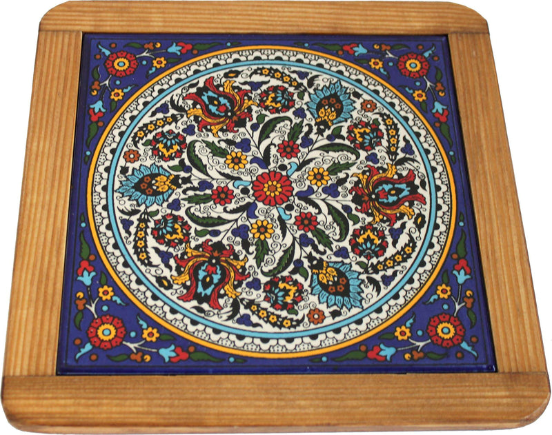 Round floral medallion with red, turquoise and yellow blooms on blue border
