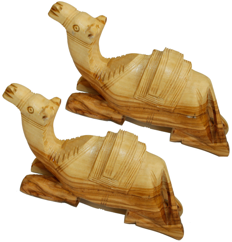 Two Olive Wood Camels with Carved Saddle as shown. Carved by Hand (7 Inches long or wide and 3.25 Inches high)