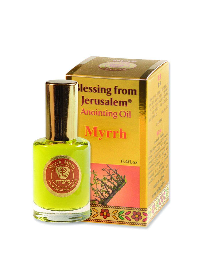 Gold box showing myrrh branches on orange panel, with green-gold oil bottle