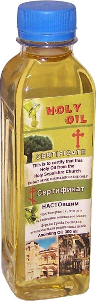 Square glass bottle of pale yellow holy oil with blue cap and certificate label